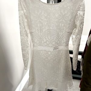White dress! Comes down to right at knees. Size 8 Jaus Brand! Open back.